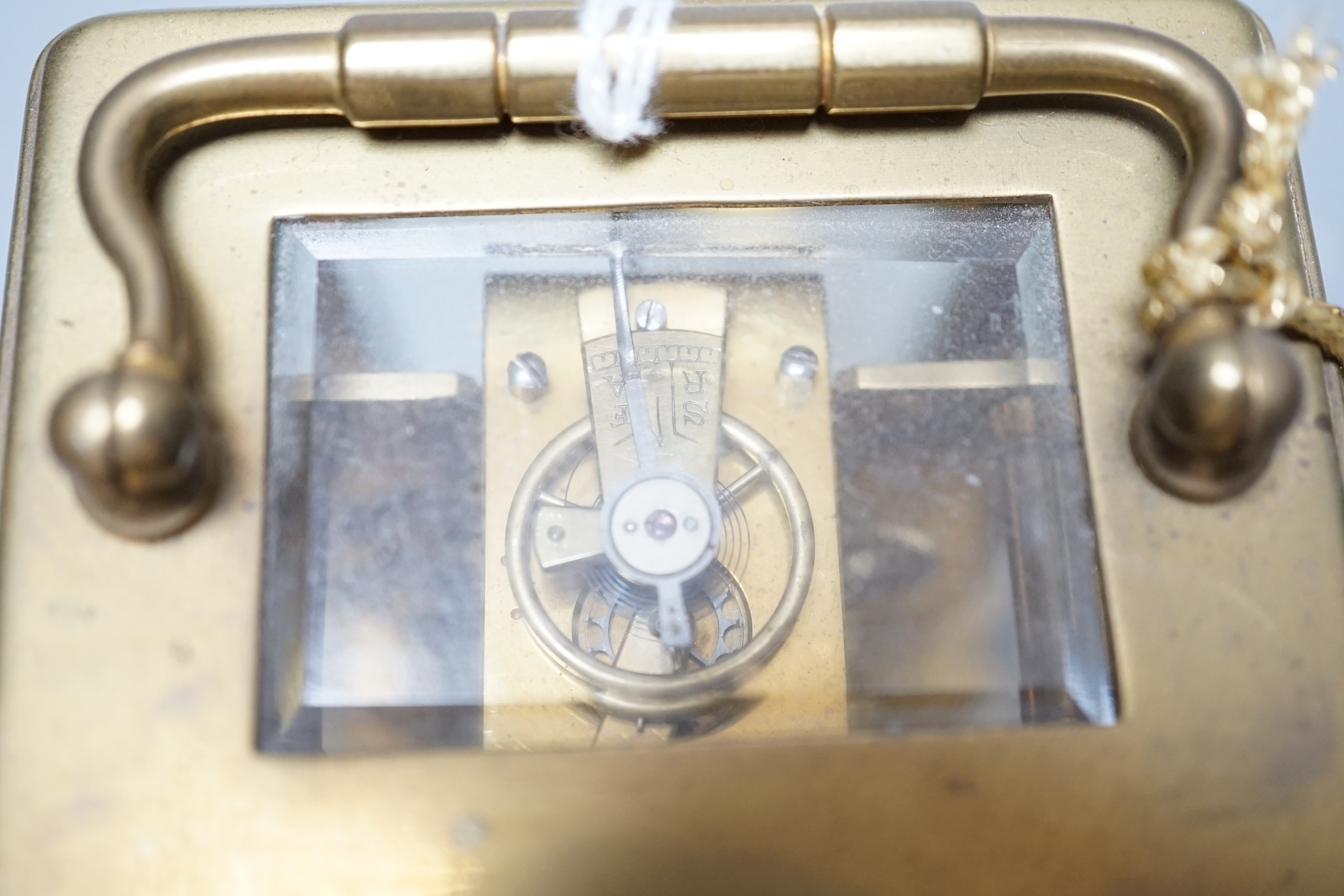 A brass carriage timepiece together with a gold plated pocket watch